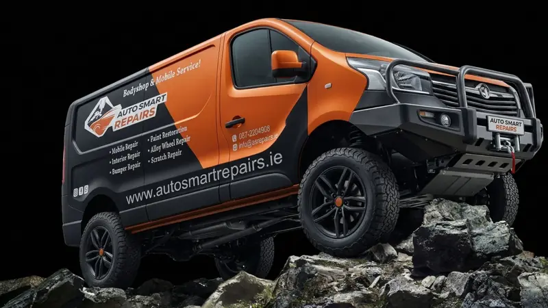 The orange and black Auto Smart Repairs mobile repair van